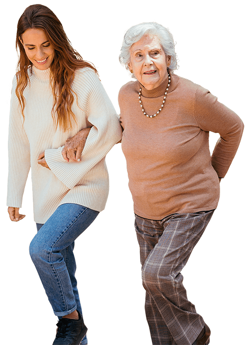 Una imagen silueteada en la que aparecen dos mujeres, una cuidadora andando mientras sostiene del brazo a una anciana.